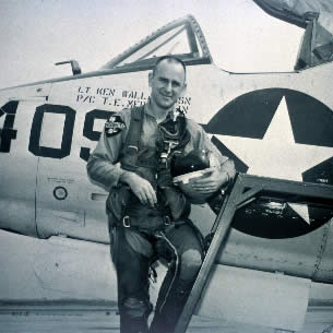 A black and white photograph of Bean standing in front of an A4 jet.
